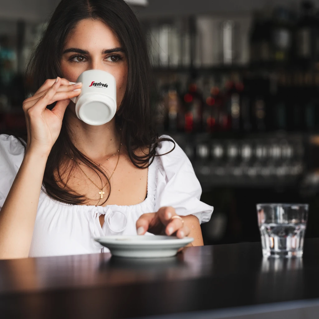 Women drinks segafredo coffee.jpg