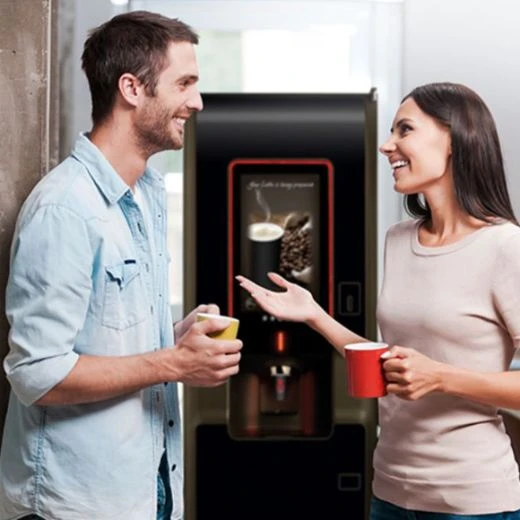 freestanding office coffee machine with people enjoying a hot beverage